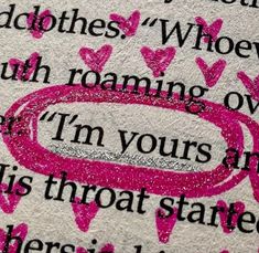 a close up of a piece of paper with pink writing on it and hearts in the middle