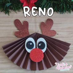 a paper fan with reindeer's nose on it and the words reno above it