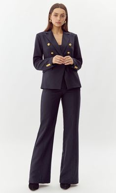 This bold blazer is adorned with gold buttons on the bodice and sleeves. The double-breasted structure also features faux, front pockets and a notched lapel. Can be matched with Colson Trousers. Blazer Double-Breasted Lined Length: 26" Chest: 17 1/4" Self: 77% Polyester, 16% Viscose, 7% Spandex Lining: 97% Polyester, 3% Spandex Hand wash in cold water with similar colors. Model is wearing a size small Style #: G247J1755 Knit Swimwear, Dark Ink, Colour Matching, Sweater Jumpsuit, Ink Blue, Short Dresses Casual, Blazer And Shorts, Blue Colour, Romper Pants