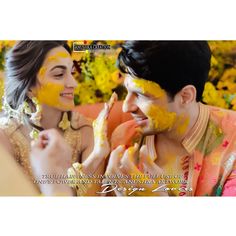 a man and woman covered in yellow paint are smiling at each other while they have their faces painted