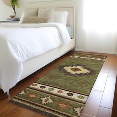 a large bed sitting next to a window on top of a hard wood floor