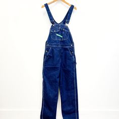 Vintage Key bib overalls, these are traditionally cut bib overalls and  feature; adjustable straps lots of pockets on the bib  a green fabric label on the bib that reads "Key "Imperial" Aristocrat of Overalls' buttons at the waist pockets at the hip and on the seat hammer loop, ruler pocket  zip fly lots of white top stitching Of a heavyweight, 100% cotton denim in a dark blue wash. Tagged a mens size 34 (waist) X 32 (length), measurements when laid out flat are; 17 1/2 inches at the waist 21 1/2 inches at the hip 13 1/2 inch rise 31 inch inseam the straps are adjustable which makes the top portion basically one size fits most In good, preworn, vintage condition with no holes, stains, or funky odors....it has a couple of loose threads in the top stitching but nothing major. We are happy to Utility Style Dark Wash Denim Jumpsuit With Bib Front, Dark Wash Utility Denim Jumpsuit With Bib Front, Utility Bib Front Overalls With Suspenders, Utility Style Overalls With Bib Front And Suspenders, Utility Style Overalls With Suspenders And Bib Front, Utility Overalls With Suspenders And Bib Front, Utility Denim Overalls With Belt Loops, Dark Wash Overalls With Suspenders, Medium Wash Bib Front Overalls With Side Pockets