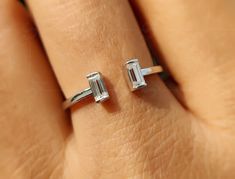 💢 𝐈𝐭𝐞𝐦 𝐃𝐞𝐬𝐜𝐫𝐢𝐩𝐭𝐢𝐨𝐧 💢 Baguette Open Cuff Ring Women / Two Stone Open Gap Wedding Band / Moissanite Stackable Rings / Minimalist Stacking Ring / Toi Et Moi Ring 💢 𝐀𝐕𝐀𝐈𝐋𝐀𝐁𝐋𝐄 𝐌𝐄𝐓𝐀𝐋𝐒 💢 ✶ Solid 925 Sterling Silver, Solid 10K, 14K, 18K White, Yellow & Rose Gold 💢 𝐒𝐓𝐎𝐍𝐄 💢 ✶ Stone Shape : Baguette Cut ✶ Stone Type : Moissanite  ✶ Moissanite Color : Near Colorless (F /G) ✶ Moissanite Clarity : VVS1   💢 𝐓𝐎𝐓𝐀𝐋 𝐂𝐀𝐑𝐀𝐓 𝐖𝐄𝐈𝐆𝐇𝐓 💢 ✶ Total Carat Weight : 0 Modern Open Ring With Baguette Diamonds, Baguette Diamond Open Ring For Promise, Wedding Rings With Baguette Diamonds And Open Ring Shape, Gold Open Ring With Baguette Diamonds, Baguette Diamond Open Ring, Mothers Ring Stackable, Music Rings, Open Cuff Ring, Dream Gift