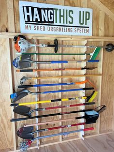 a rack with many different types of gardening tools