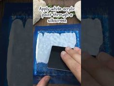 a person is using a cell phone to paint the back of a fake toothpaste