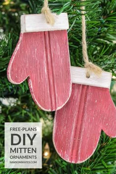 two wooden mittens hanging from a christmas tree with text overlay that says free - plans diy mitten ornaments