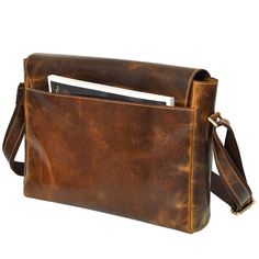 This brown satchel messenger bag, made from genuine leather, combines vintage charm with modern functionality. With ample space and an adjustable strap, it's a stylish and durable companion for any adventure. Brown Satchel Saddle Bag For Travel, Classic Brown Laptop Bag With Flap, Distressed Brown Leather-lined Satchel Shoulder Bag, Vintage Brown Flap Bag For Travel, Vintage Leather Crossbody Laptop Bag, Vintage Brown Rectangular Saddle Bag With Adjustable Strap, Distressed Brown Waxed Finish Shoulder Bag, Distressed Brown Satchel For Travel, Brown Shoulder Laptop Bag With Detachable Strap