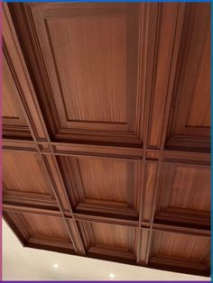 the ceiling is made up of wood paneling