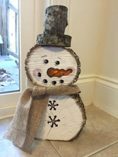 a snowman made out of wood and burlied with jumbles on it