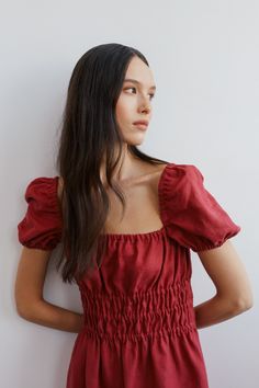 "HOLIDAY is an elegant puff short sleeve linen midi dress.  DETAILS - Puff short sleeve - Elasticated body - Midi length - Oeko-Tex certified 100% local washed midweight linen - Cut and sewn to order just for you in our studio COLOR - Raspberry, you can also choose other colors above - Fabric samples are available here https://www.etsy.com/listing/586569696/linen-fabric-samples SIZING & FIT - Fit true to size - Model is 5'9.5\" / 177cm and wearing a size XS CARE FOR LINEN - Machine wash up to 30ºC/86ºF gentle cycle - Lay flat to dry or tumble dry low - Warm iron if needed - Do not bleach SIZE GUIDE Size conversion guide Size XS (US 0-2, IT 36-38, UK 4-6, Japan 3-5, France 32-34) Size S (US 4-6, IT 40-42, UK 8-10, Japan 7-9, France 36-38) Size M (US 8-10, IT 44-46, UK 12-14, Japan 11-13, Fr Cotton Puff Sleeve Top For Brunch, Short Sleeve Puff Sleeve Top For Daywear, Ruched Puff Sleeve Top For Day Out, Summer Short Sleeve Puff Top, Short Sleeve Puff Sleeve Dress For Day Out, Summer Puff Sleeve Top For Daywear, Short Sleeve Puff Top For Summer Daywear, Summer Puff Sleeve Top With Short Sleeves For Daywear, Summer Puff Sleeve Top With Smocked Bodice