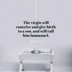 a white table with a quote on it that says the virgin will conceive and give birth to a son, and will call him immanuel