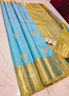 1.this is beautiful pure kanjivaram silk sari with ine gram gold zari weaving with running blouse piece 2.this sari is 5.5 mt length  3.this is a very elegant looking sari for all occasions like weddings and other formal events  4.fall n pico is complimentary  5.blouse can be made as per the requirements of the clients with proper measurements.stiching charges will be extra  6.plz check the availability of the sari before placing the order Gold Tussar Silk Saree Silk Mark Certified, Gold Silk Mark Certified Saree For Puja, Gold Silk Mark Certified Saree For Festivals, Gold Katan Silk Traditional Wear, Silk Mark Certified, Silk Sari, Blouse Piece, Beauty Book, Accessory Gift, Pet Supplies