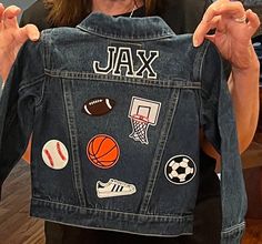 This personalized jean jacket looks great with any outfit and it perfect for all seasons! 🎉 Option Name+ Max 5 Patches: The name/word of your choice + up to 5️⃣ decorative patches (see photos) 🎉 Option Name+ Max 10 Patches: The name/word of your choice + up to 🔟 decorative patches (see photos) TO ORDER: Choose your jacket size and customization option. ⭐️PERSONALIZATION⭐️ 1️⃣. Name/word as it should be written on the jacket AND letter color choice(s) 🎨Letter Patch Colors: White, Black, Green Patch Jean Jacket, Denim Jacket With Patches, Boys Jean Jacket, Denim Jacket For Men, Jacket With Patches, Jean Jacket Patches, Custom Denim Jacket, Denim Jacket Patches, Custom Denim