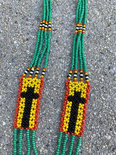 "Make this African necklace yours. Length: 14.5\" Width of bottom: 2\"" Vintage Black Beaded Festival Necklace, Retro Beaded Jewelry For Festivals, Retro Beaded Necklaces For Jewelry Making, Retro Beaded Necklaces For Festivals, Beaded Cross Necklace, African Necklace, Beaded Cross, Beaded Necklaces, Vintage Jeans