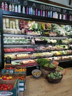 the produce section of a grocery store filled with fresh fruits and vegetables