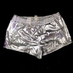 Silver Shorts W/ Pockets Metallic Stretch Disco Shorts, Silver Stretch Bottoms Short Length, Stretch Shiny Short Bottoms, Shimmer Bottoms For Night Out In Summer, Shimmer Bottoms For Summer Night Out, Summer Shimmer Bottoms For Night Out, Summer Night Out Shimmer Bottoms, Silver Stretch Bottoms For Summer, Silver Stretch Bottoms For Spring