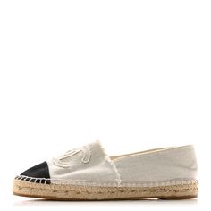 This is an authentic pair of CHANEL Linen CC Espadrilles size 40 in Beige and Black. These espadrille flats have a natural fiber textile midsole with a durable upper of white linen. A black cap toe is featured on this shoe along with a prominent CC logo. Espadrilles Flats, Espadrille Flats, Fibres Textiles, Beige And Black, Black Cap, Flat Espadrilles, Cc Logo, White Linen, Natural Fibers