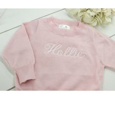 Baby girls pink monogrammed sweater features round crewneck and is made of soft lightweight cotton.  Personalized sweater makes a great baby shower gift. 100% Cotton Machine washable Pink Long Sleeve Sweatshirt With Name Print, Personalized Pink Crew Neck Sweater, Pink Monogrammed Crew Neck Top, Pink Monogram Crew Neck Top, Pink Crew Neck Top With Monogram, Personalized Pink Crew Neck Sweatshirt, Personalized Pink Long Sleeve Sweater, Personalized Pink Sweater For Winter, Personalized Cute Crew Neck Sweater