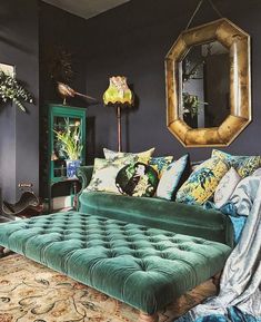 a living room filled with lots of furniture and decor on top of a carpeted floor