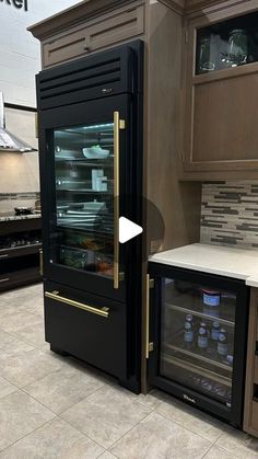 a kitchen with two ovens and cabinets in it