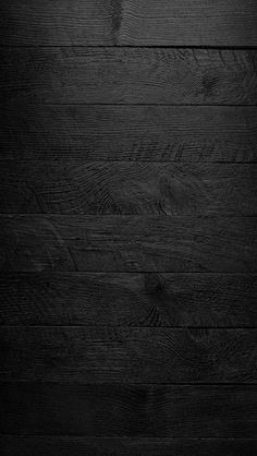 black wood texture background with some grainy lines on the top and bottom part,