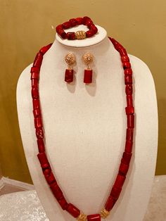 Elegant handmade coral necklace set. Made with genuine Red Bamboo coral tubes, and gold plated beads. It comes with matching earrings and a bracelet Jewelry Type: Coral Beads Jewelry Set Main material: Natural Red Coral gemstone beads & gold plated beads The Set includes: Necklace length- 32 inches One Pair of Earrings One bracelet Color: Genuine Red Coral Made in United States Please feel free to contact me if you hope to know any other details. Red Gemstone Beads Jewelry For Wedding, Red Hand-strung Necklace For Wedding, Red Coral Jewelry For Wedding, Red Coral Wedding Jewelry In Red, Red Coral Wedding Jewelry, Red Coral Jewelry With Gold Beads, Gold Red Coral Jewelry For Wedding, Elegant Red Coral Jewelry With Faceted Beads, Handmade Red Coral Wedding Jewelry