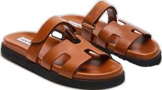 Trendy Brown Leather Footbed Sandals, Brown Leather Platform Slides, Trendy Brown Leather Slides, Trendy Brown Footbed Sandals With Removable Insole, Modern Brown Slides For Vacation, Trendy Brown Footbed Sandals With Textured Footbed, Trendy Leather Double Strap Footbed Sandals, Brown Double Strap Casual Slides, Modern Brown Footbed Sandals With Round Toe