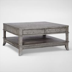 a coffee table with two drawers on each side