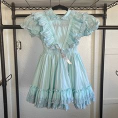 Like New In Excellent Condition This Babydoll Dress Is A One Of A Kind. Baby Blue Fit And Flare Dress Full Circle Skirt Button Down Back Short Puff Sleeves, Elastic May Need To Be Replaced Tie At Waist Machine Wash/ Tumble Dry Size 6x Measures Approx: Armpit To Pit: 13" (33 Cm) Sleeve Length : 4" (10 Cm) Total Length: 25" (63.5 Cm) Babydoll Dress Puff Sleeve, Poofy Short Dress, Babydoll Dress Sewing Pattern, Short Poofy Dresses, Blue Baby Doll Dress, Coquette Princess, Blue Babydoll Dress, Claudia Dress, Blue Green Dress