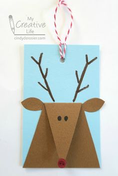 an origami deer with antlers on it's head hanging from a string