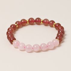 Discover the enchanting beauty of our Natural Strawberry Quartz and Rose Quartz stretch bracelet. Crafted with love and care, each bead holds the soothing energy of these gemstones. Embrace the power of nature and elevate your style with this versatile and elegant accessory. Natural Stones Stone Size 8mm Bracelet Size 17cm Handmade Pink Beaded Bracelets For Meditation, Elegant Hand-strung Stretch Bracelet For Meditation, Crystal Bracelet With Round Beads For Meditation, Elegant Gemstone Beads Stretch Bracelet For Meditation, Meditation Crystal Bracelet With Round Beads, Elegant Rose Quartz Stretch Bracelet With Round Beads, Elegant 8mm Beads Stretch Bracelet For Meditation, Elegant Stretch Bracelet With 8mm Beads For Meditation, Elegant Rose Quartz Crystal Bracelet For Meditation