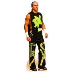 a man standing in front of a white background wearing black and neon green wrestling gear