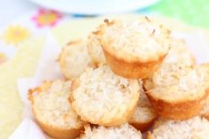 a pile of muffins sitting on top of a white plate