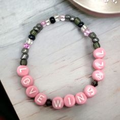 Love Wins All by IU and V of BTS beaded bracelet. Inspired by the single cover, the bracelet is designed in shades of grey and pink.  Please keep in mind that colors may appear different due to individual screen settings. Pink Beaded Kpop Bracelets, Pink Kpop Beaded Bracelets, Kpop Pink Beaded Bracelets, Personalized Pink Kpop Style Jewelry, V Of Bts, Bts Accessories, Bracelet Inspired, Love Wins, Bracelet Design