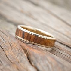 a wooden ring sitting on top of a wooden table