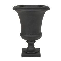 a black vase sitting on top of a wooden stand in front of a white background