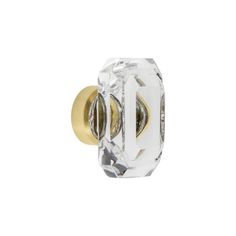 an image of a glass door knob on a white background with gold trimmings