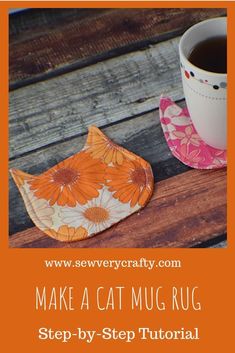 a cup and saucer sitting on top of a wooden table next to each other