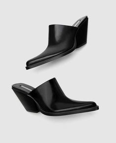 black clog-style shoes. High cut vamp. Smoke and pet free. Thanks for looking:) Formal Slip-on Clogs With Reinforced Heel, Modern Slip-on Heels With Wooden Heel, Modern Black Mules With Reinforced Heel, Modern Black Mules With Padded Heel, Slip-on Synthetic Clogs With Padded Heel, Black Clogs With Sculpted High Heel, Modern Black Clogs With Sculpted Heel, Casual Mules With Wooden Heel And Square Toe, Modern Black Mules With Stacked Heel