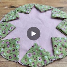 a video demonstrating how to sew an origami flowered star on a piece of fabric