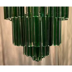 a green chandelier hanging from the ceiling