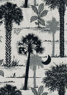 a black and white palm tree pattern on a linen material with an image of the moon in the distance