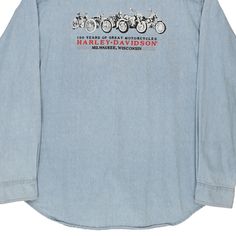 the back of a denim shirt with an image of motorcycles on it and words that say harley davidson