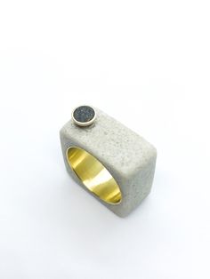 This listing is for a black and white cement and resin ring on brass. The ring consists of mostly white cement with an inlay of black cement and charcoal in a brass accent, Set over a brass ring. The ring is approximately a size 8, but can fit 7.5-8. All items are hand made and unique.  *PLEASE READ* After continuous wear, brass jewelry can develop a black residue (oxidation). This is very easily fixed by soaking your jewelry in lemon juice for no more than fifteen seconds, then rinsing it in wa Concrete Minimalist, Modernist Silver Dome Ring Open Style, Brutalist Ring With Oxidized Finish As Gift, Brutalist Open Ring With Oxidized Finish, Concrete Ring, Modernist Sterling Silver Dome Ring, Unique Promise Rings, White Cement, Black Cement