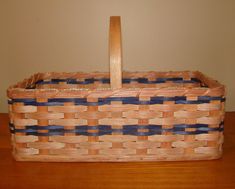 a wooden basket sitting on top of a table