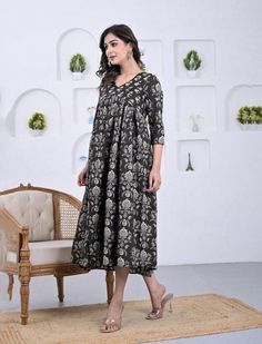 This printed ethnic wear dress is presented to you, A well-known brand in hand block prints from over 9 decades. This exclusively hand stitched dress is made of 100% pure cotton fabric with having printed prints over it. The dress is best suitable for you to showcase your women hood. Wear this at your ease and the fabric is so smooth to skin that you will love it and the attractive prints adds more charm to the same. Material : 100% Cotton dress Length : 54 Inches Disclaimer : As the fabric is b Traditional Cotton Dress With Kalamkari Print, Festive Cotton Ikat Print Dress, Festive Cotton Dress With Bandhani Print, Black Dresses With Printed Motifs For Festive Season, Festive Black Dress With Printed Motifs, Cotton Anarkali Dress With Block Print, Festive Cotton Maxi Dress With Printed Motifs, Cotton Anarkali Dress With Batik Print, Maxi Length Cotton Kurta With Printed Motifs