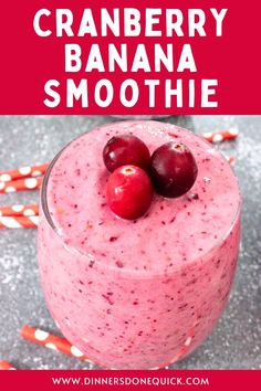 cranberry banana smoothie in a glass with two cherries on the top