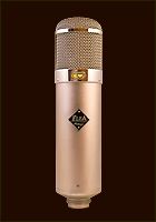 an old fashioned microphone is shown on a brown background with gold trimmings and a black diamond in the center