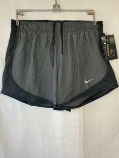 $30 Nike Running Shorts Women SMALL DriFit Dry Grey Training Workout Ladies New Size: SMALL Color: Two tone Gray Grey MSRP: $30 + tax Brand New with Tags Approx Measurements: Waist = 25 inches Inseam = 3 inches Front Rise = 10.5 inches Iconic Nike running shorts that’s light and breezy Dri-Fit technology to stay dry and comfortable Curves Mesh on the sides increases airflow Standard fit Interior brief liner Interior center-front drawstring I stand by my sale. Returns accepted within 30 days. Ite Nike Gray Athletic Shorts For Athleisure, Nike Gray Athleisure Athletic Shorts, Comfortable Nike Activewear For Workout, Nike Gray Athletic Shorts For Sports, Nike Gray Athletic Fit Activewear, Casual Nike Activewear For Running, Sporty Gray Nike Activewear, Nike Sporty Gray Activewear, Sporty Gray Athletic Shorts