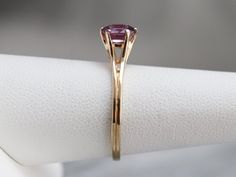 "Truly all about the stone, this elegant, simple, yellow gold mounting frames the stone perfectly while holding it securely. The gemstone pops with color, set with an expertly cut pink Ceylon sapphire. Set low to the finger, this would make a spectacular engagement ring, comfortable to wear with a variety of bands! Metal: 14K Yellow Gold Gem: Ceylon Pink Sapphire 1.02 Carats Gem Measurements: 6.6 x 5.7 mm, Oval Ring Size: 7 Marks: \"14K BDW\" Stamped on the inside band SKU #: UUHQRF82 Each piece Sapphire Engagement Ring Yellow, Sapphire Engagement Ring Yellow Gold, Yellow Gold Sapphire Ring, Engagement Ring Yellow Gold, Engagement Ring Yellow, Sapphire Solitaire Ring, Gold Sapphire Ring, Sapphire Solitaire, Ceylon Sapphire